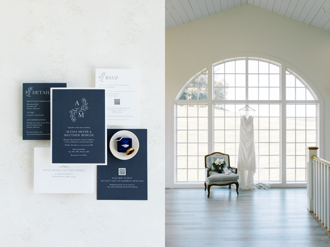Elegant navy and white wedding invitation suite for Alyssa and Matthew, paired with rings in a blue velvet box, alongside a bridal gown displayed near a large arched window at Westwind Hills.