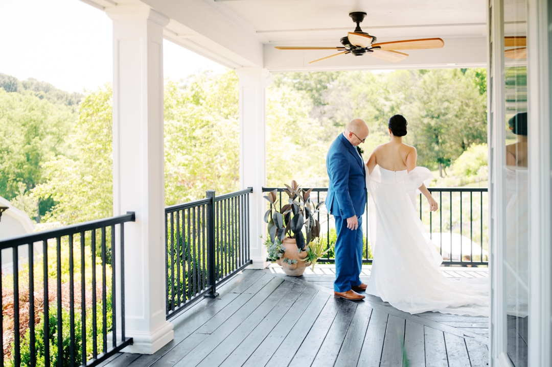 Suzie and Russell sharing their emotional first look on the grounds of Sunflower Hill Farm.
