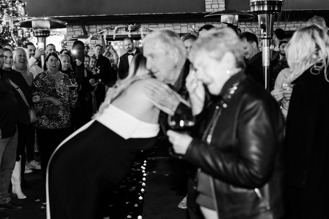 Eric planned a romantic scavenger hunt around St. Louis to propose to Gracie, ending the evening at Napoli where he popped the question surrounded by friends and family.