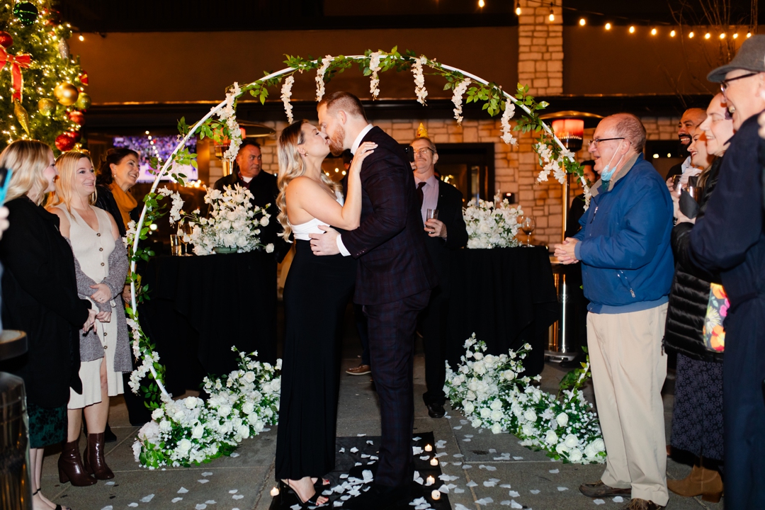 Scavenger hunt proposal at Napoli in St. Louis with Eric and Gracie, featuring sparklers and a heartfelt moment surrounded by loved ones.
