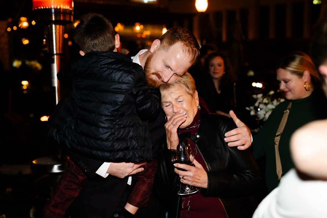 Eric hugging his mom.