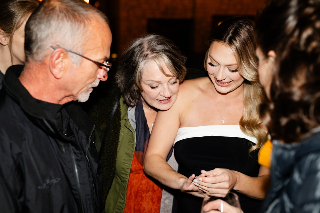 Gracie is admiring her beautiful ring from a scavenger hunt proposal from Eric.