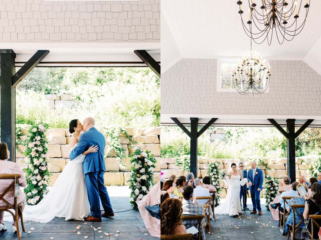 Suzie and Russell exchanging vows on the covered outdoor patio at Sunflower Hill Farm, surrounded by lush floral arrangements.