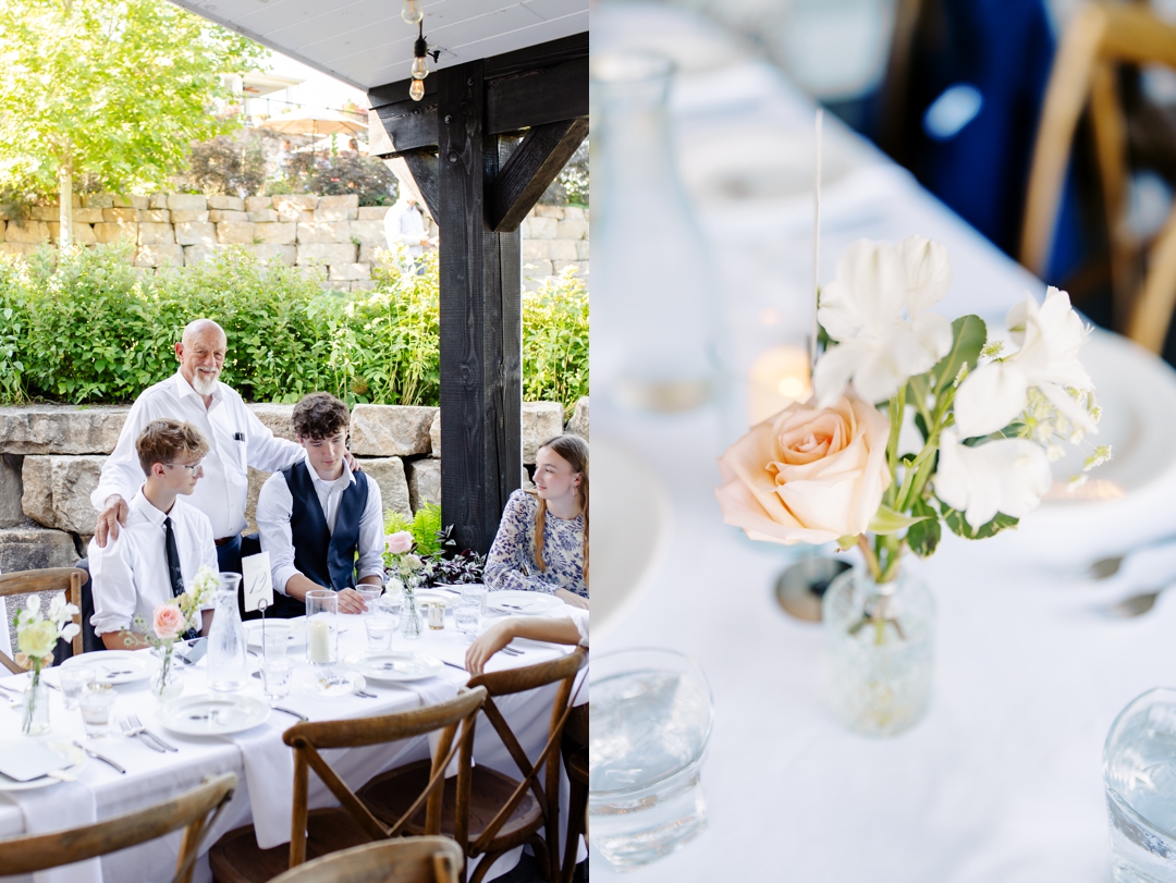 Guests enjoying cocktail hour at Sunflower Hill Farm, mingling under the covered patio with scenic views in the background.