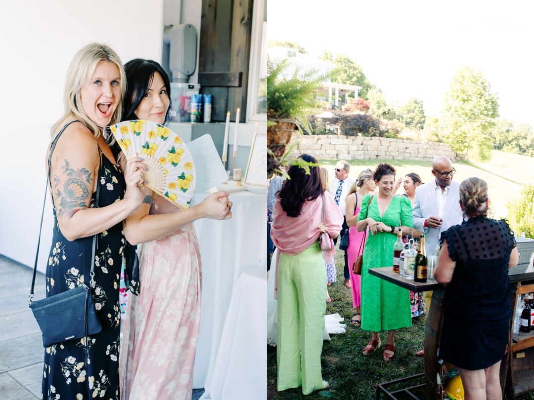 Guests enjoying cocktail hour at Sunflower Hill Farm, mingling under the covered patio with scenic views in the background.