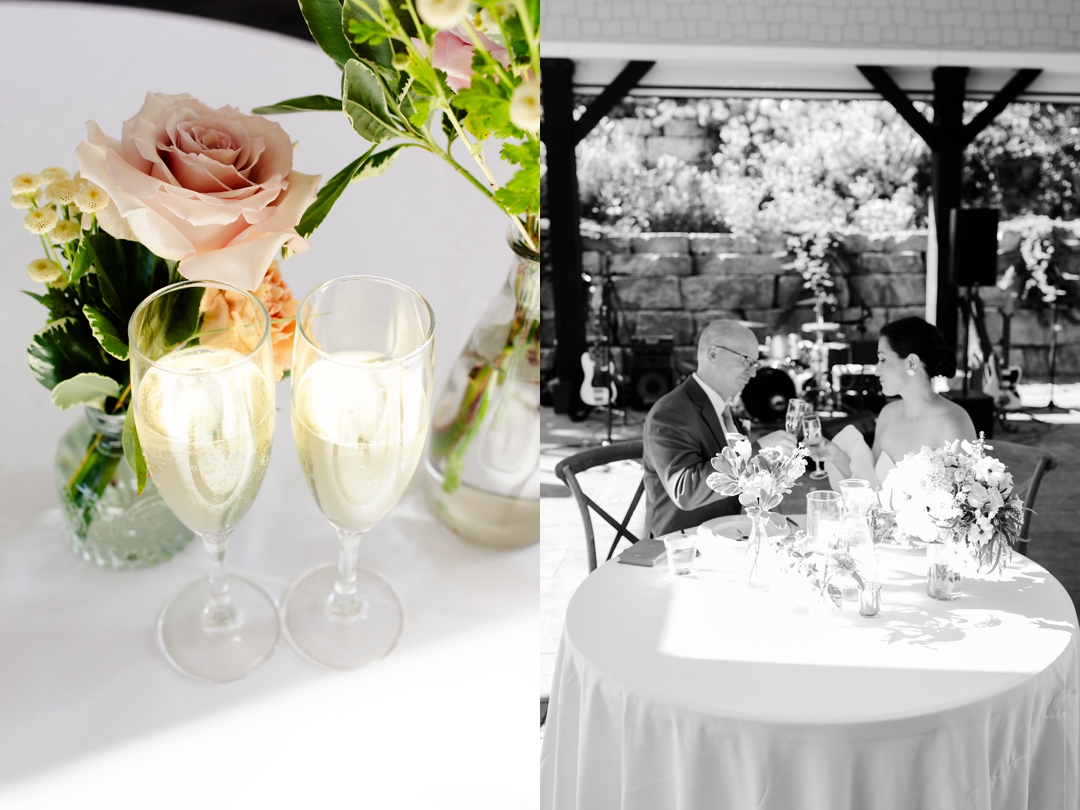 Reception tables set under the covered patio at Sunflower Hill Farm, with open doors connecting to the indoor space for a seamless celebration.