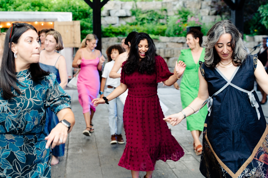 Guests dancing to music by Diamond Empire during Suzie and Russell’s wedding reception at Sunflower Hill Farm