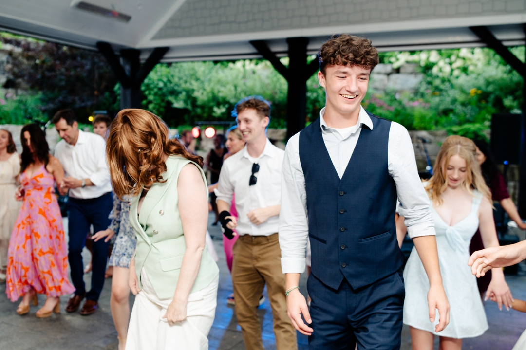Guests dancing to music by Diamond Empire during Suzie and Russell’s wedding reception at Sunflower Hill Farm