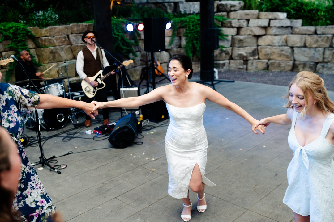 Guests dancing to music by Diamond Empire during Suzie and Russell’s wedding reception at Sunflower Hill Farm