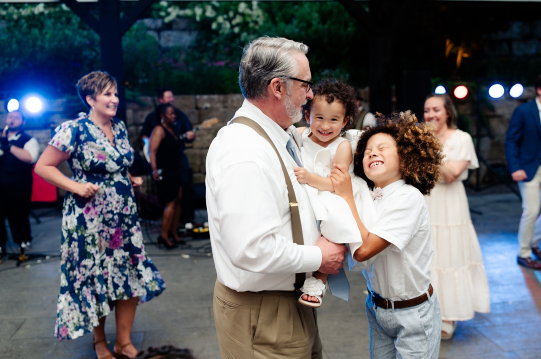 Guests dancing to music by Diamond Empire during Suzie and Russell’s wedding reception at Sunflower Hill Farm
