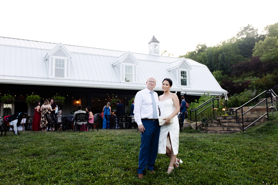 Romantic portrait of Suzie and Russell on the grounds of Sunflower Hill Farm, captured during golden hour.