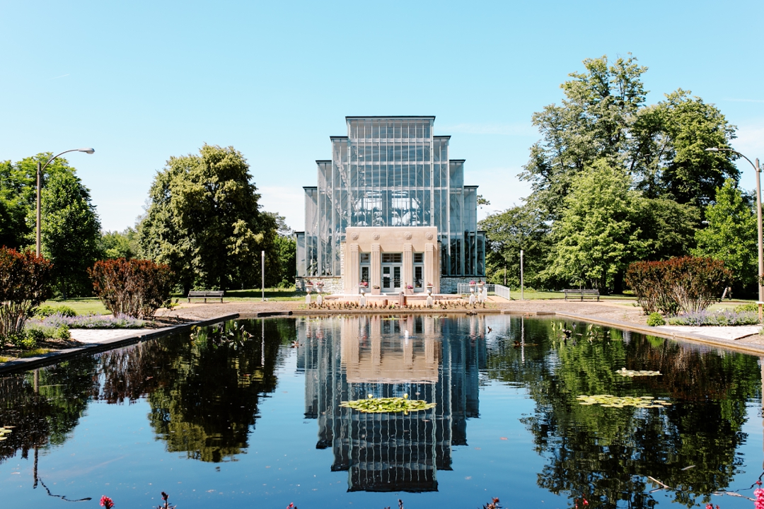 The Jewel Box wedding venue surrounded by vibrant greenery in Forest Park, St. Louis.