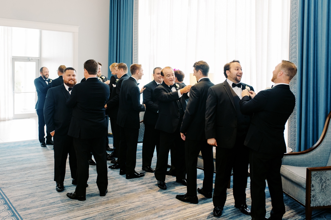 Mike and his groomsmen getting ready in a luxurious suite at The Chase Park Plaza.