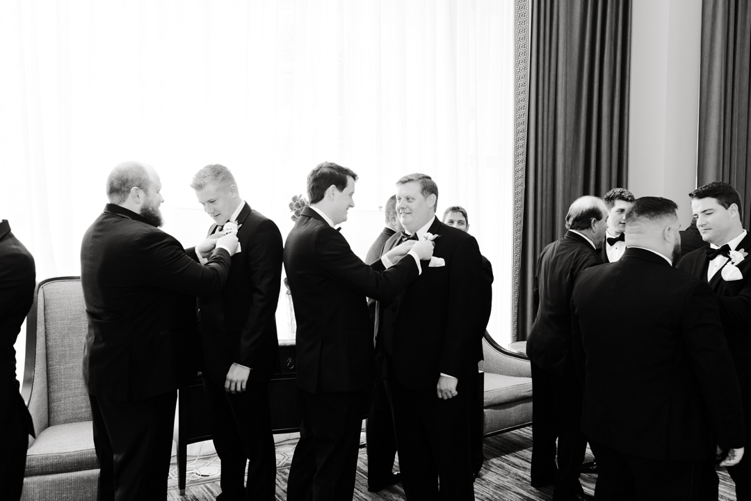 Mike and his groomsmen getting ready in a luxurious suite at The Chase Park Plaza.