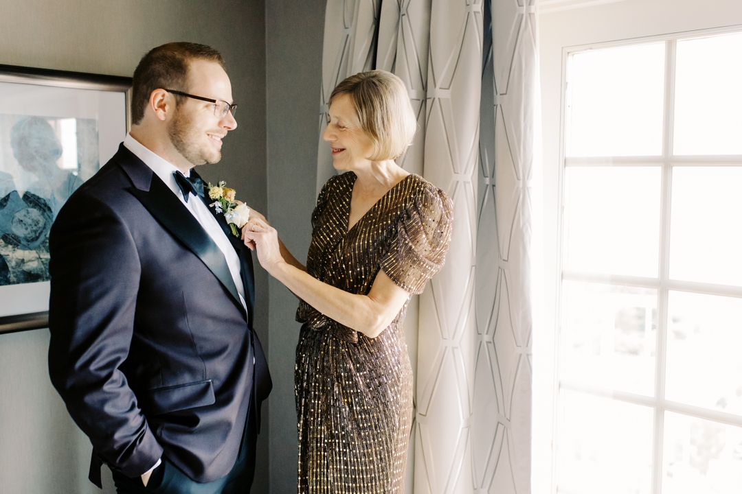 Nathan wearing his burgundy jacket during wedding preparations at The Ritz-Carlton St. Louis.