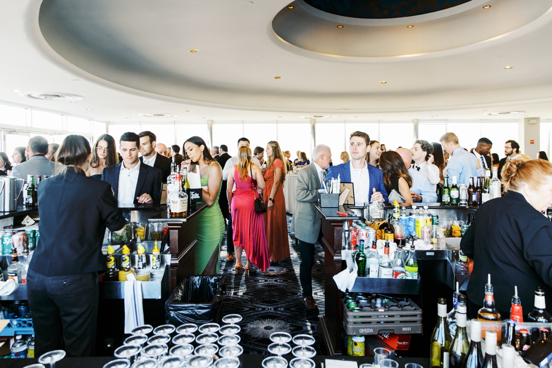 Guests mingling during cocktail hour at The Chase Park Plaza with elegant decor and warm lighting.
