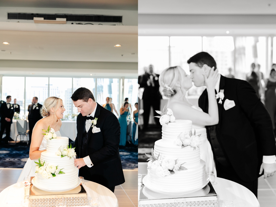 Amanda and Mike laughing while feeding each other wedding cake at The Chase Park Plaza reception.