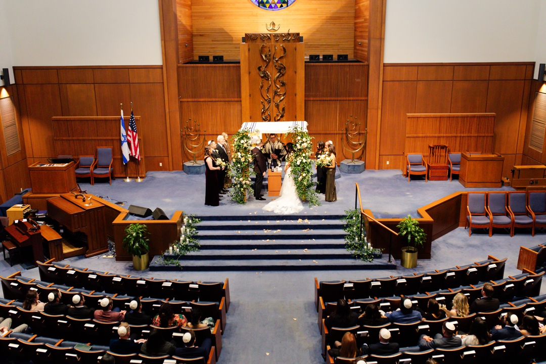 Wide shot of the Jewish wedding ceremony at United Hebrew Congregation.
