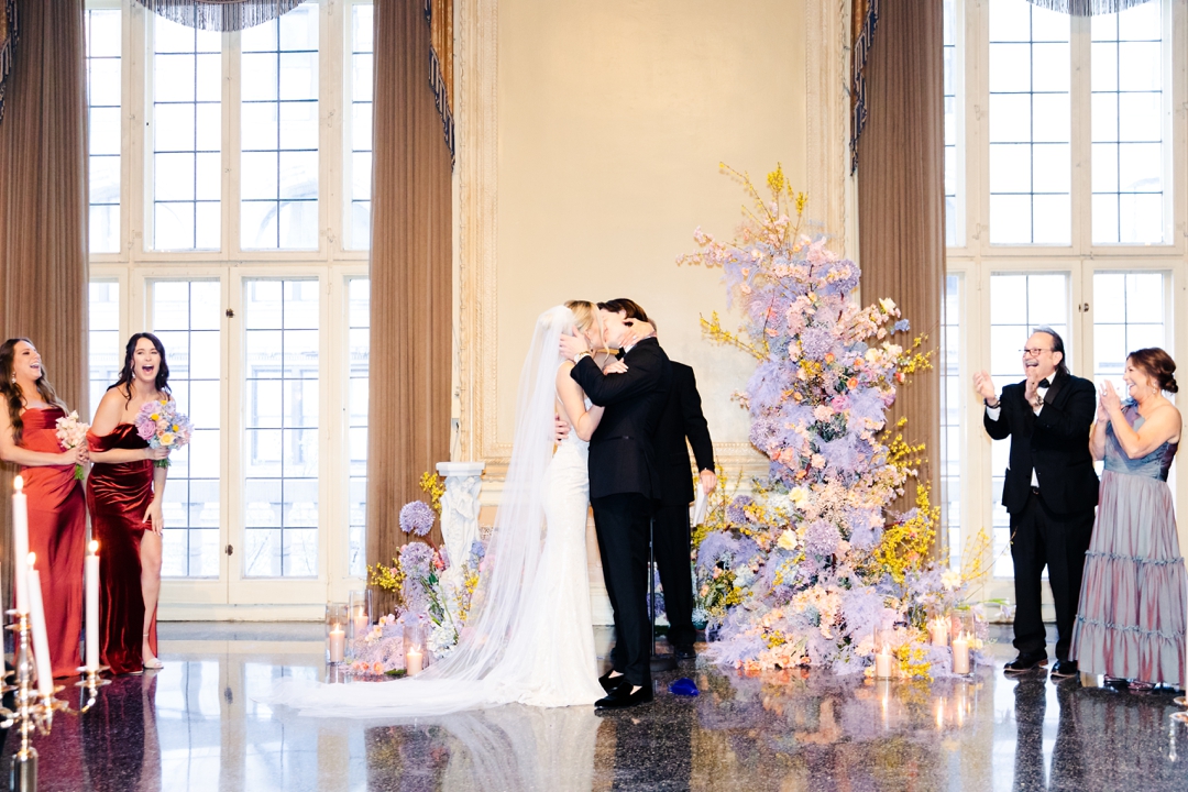 Deane and Jeff sharing their first kiss as a married couple during their elegant MAC ceremony.