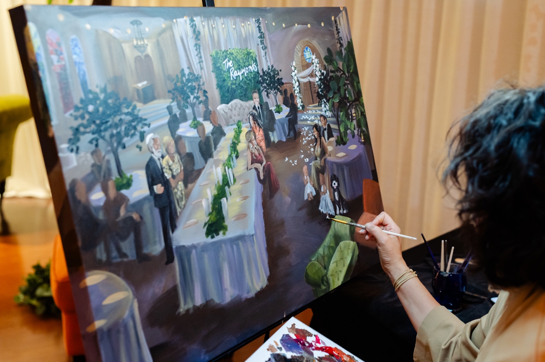 Live painter capturing the wedding reception at United Hebrew Congregation.