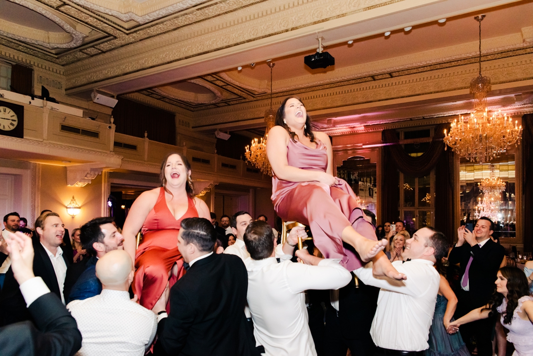 Lively wedding guests enjoying the music on the packed dance floor during Deane and Jeff’s reception.