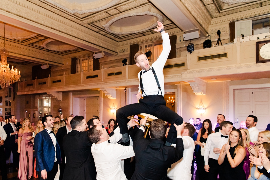 Lively wedding guests enjoying the music on the packed dance floor during Deane and Jeff’s reception.