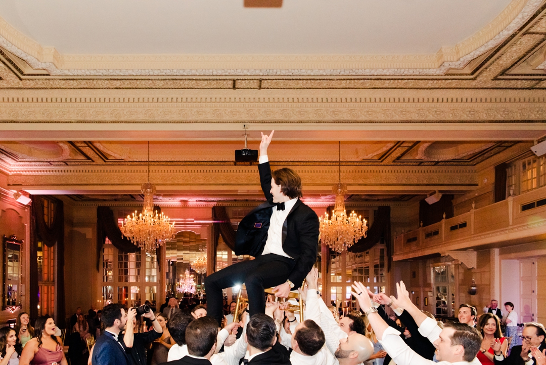 Lively wedding guests enjoying the music on the packed dance floor during Deane and Jeff’s reception.