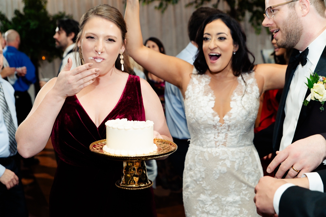 Guests singing Happy Birthday to Allie and Nate’s friend on the dance floor during the reception.