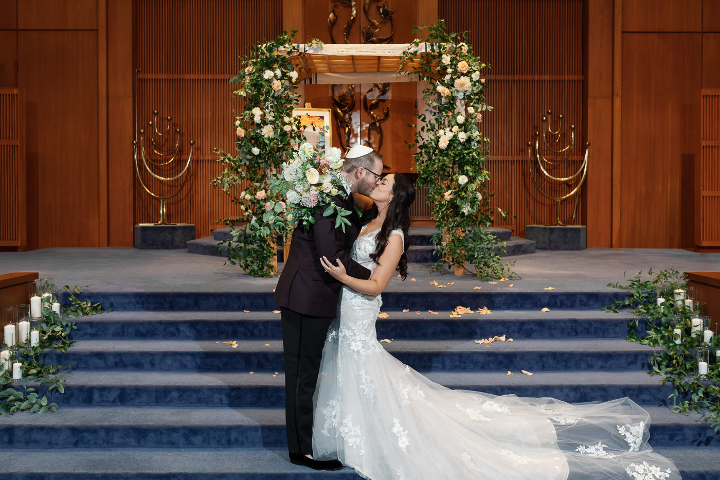 Jewish wedding ceremony under floral chuppah at United Hebrew Congregation in St Louis
