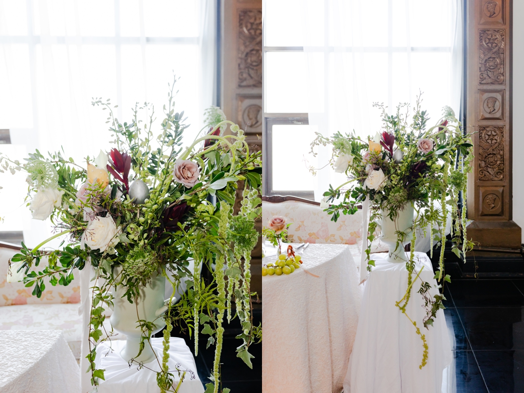 Elegant wedding floral arrangement by Rouge Floral Design featuring deep burgundy peonies, blush roses, and lush greenery, styled for an Art Deco wedding at The Noble in St. Louis.