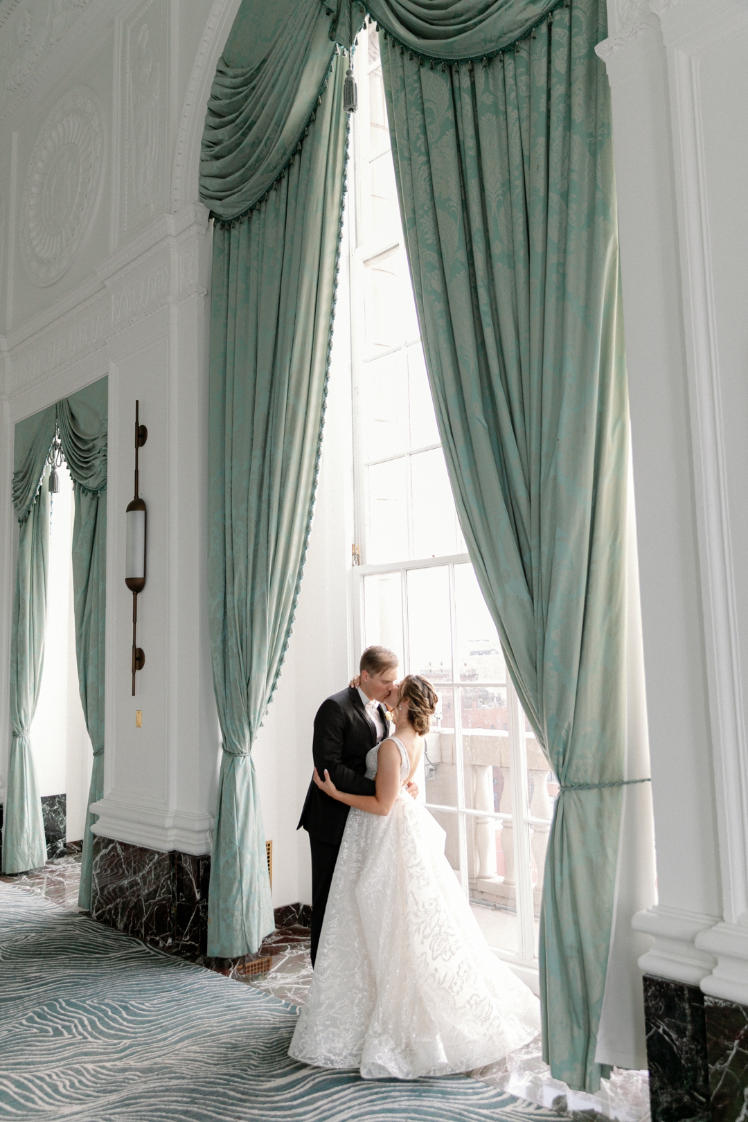 Editorial wedding portrait planned around architecture and natural light