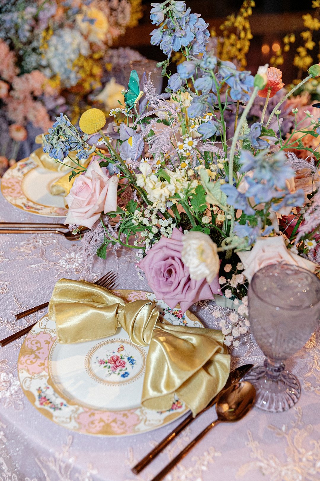 Colorful floral tablescape with a vintage place setting