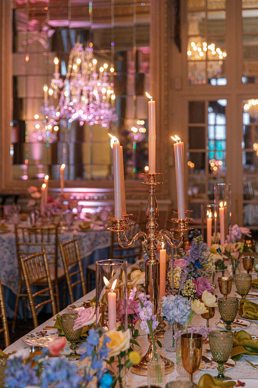 Cinematic wedding atmosphere with candlelight, layered details, and modern reception styling