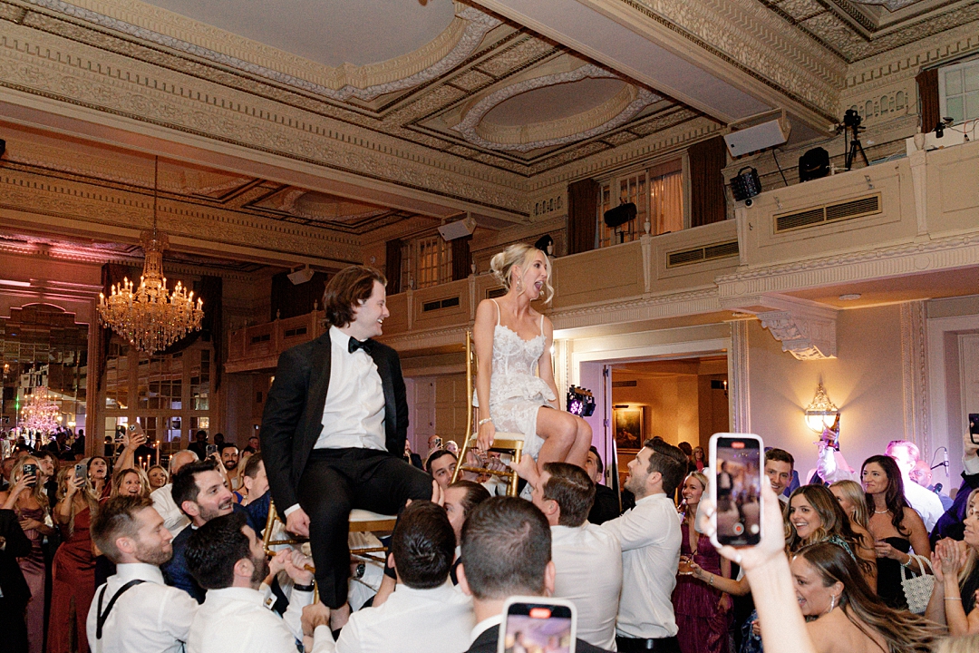Deane and Jeff lifted above the crowd during their wedding reception