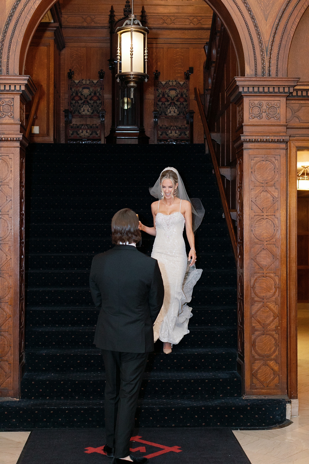 Deane descending the staircase for her first look at the Missouri Athletic Club