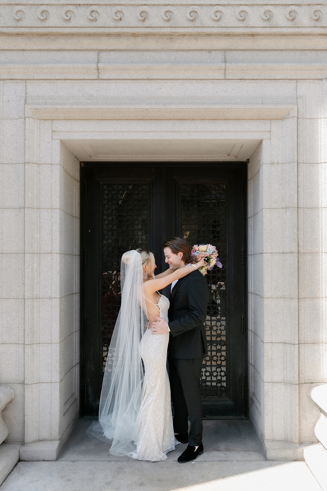 Deane and Jeff framed by monumental St. Louis architecture