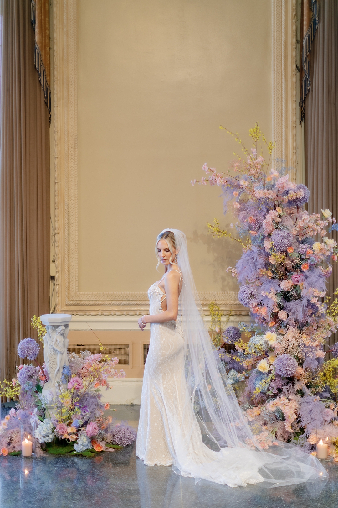 Editorial bridal portrait beside colorful Missouri Athletic Club florals