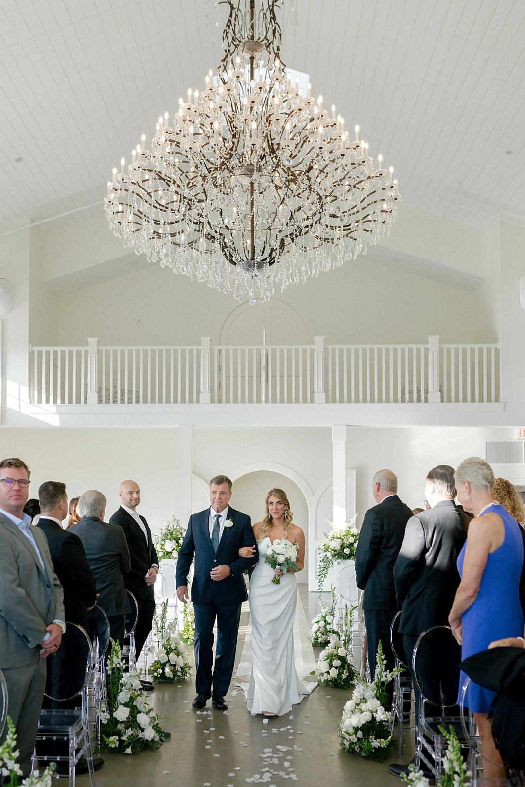 Bride walking down the aisle during indoor Westwind Hills ceremony