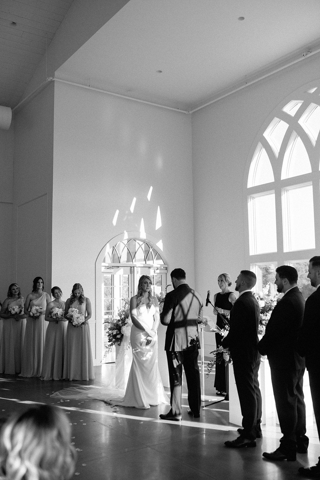 Bride and groom kissing during their Westwind Hills wedding ceremony