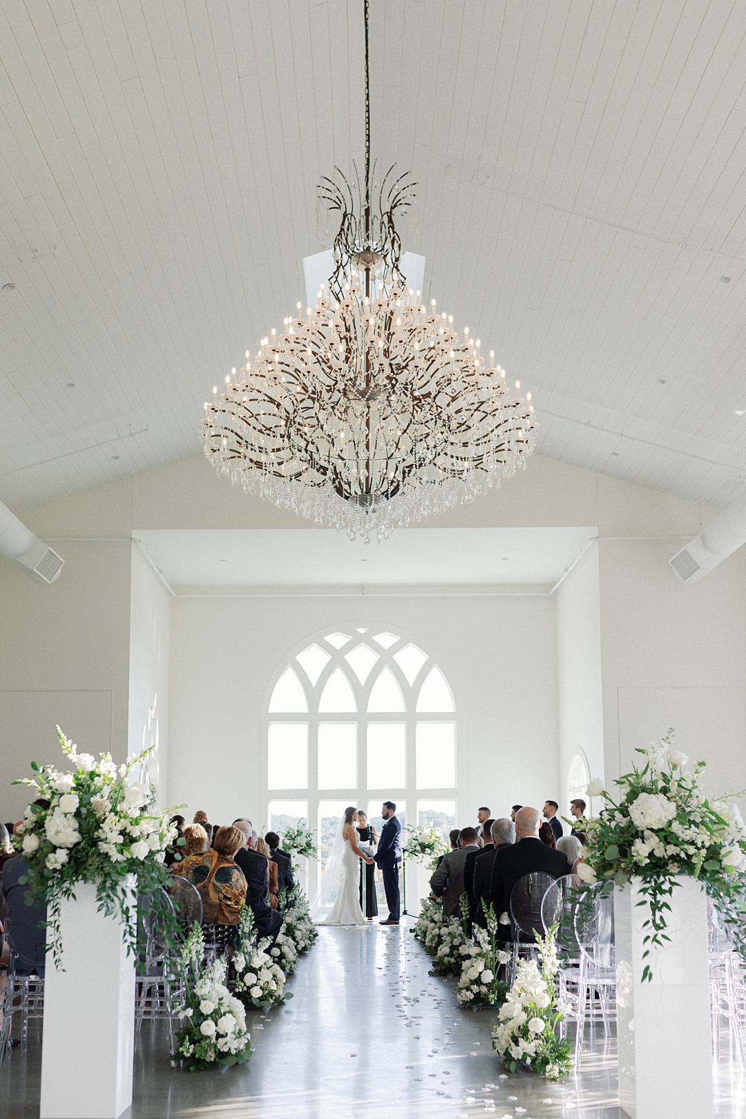 wide documentary style photo of wedding ceremony at westwind hills