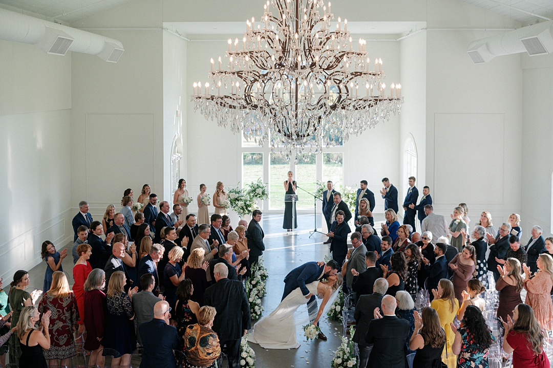 Wide ceremony view inside Westwind Hills wedding venue with chandelier
