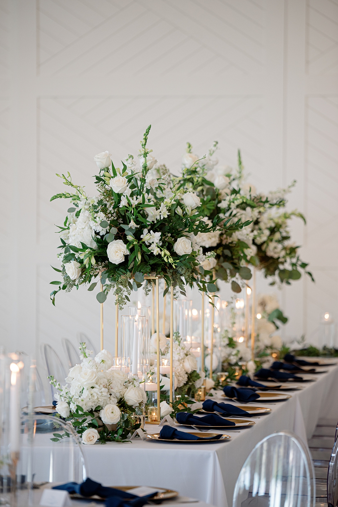 Tall floral centerpiece photographed at Westwind Hills wedding reception