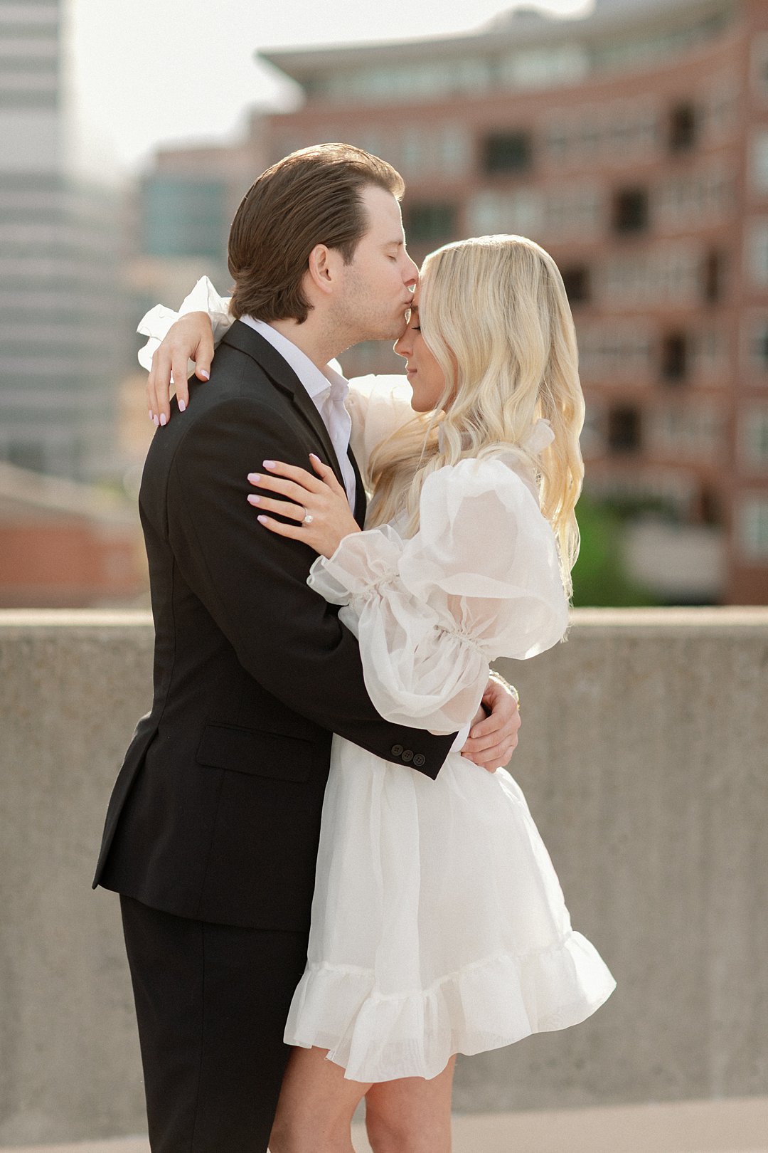 Black and white engagement portrait in downtown Clayton