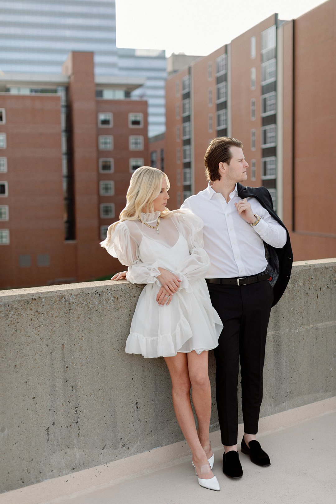 Editorial couple portrait with city backdrop in downtown Clayton