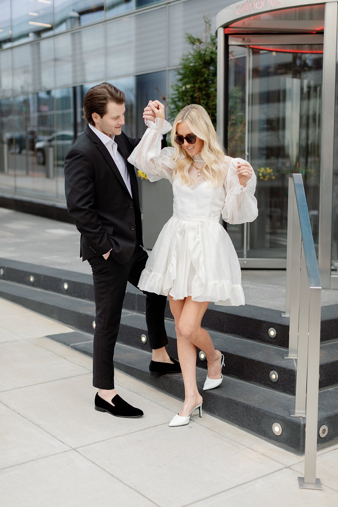 Candid movement portrait from downtown Clayton engagement photos