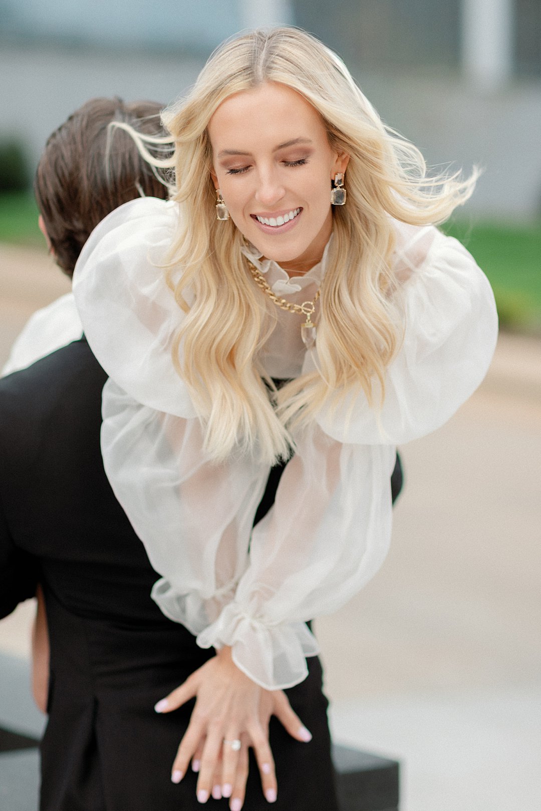 Couple walking together in downtown Clayton engagement photos