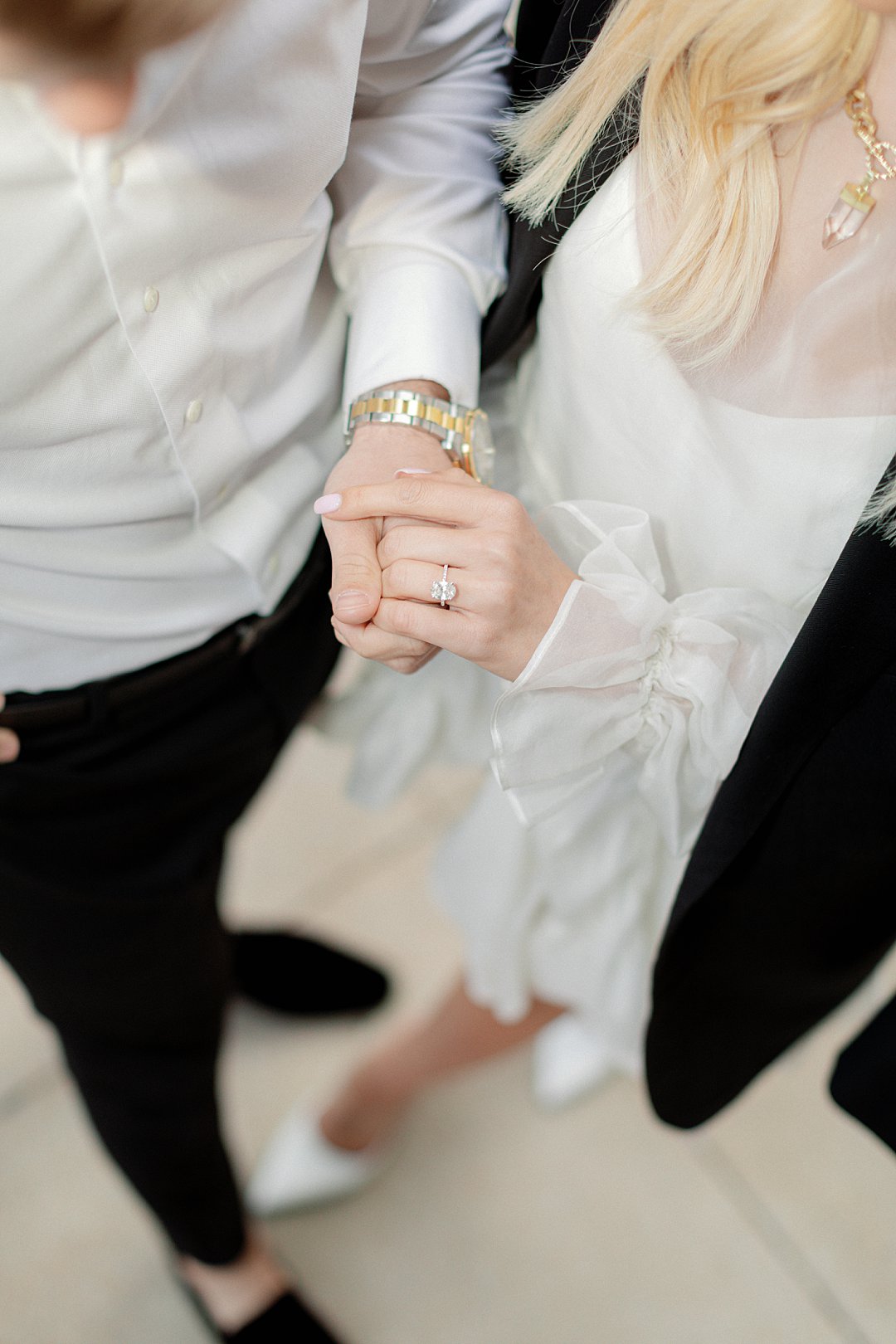 Hands and engagement ring detail from downtown Clayton engagement photos