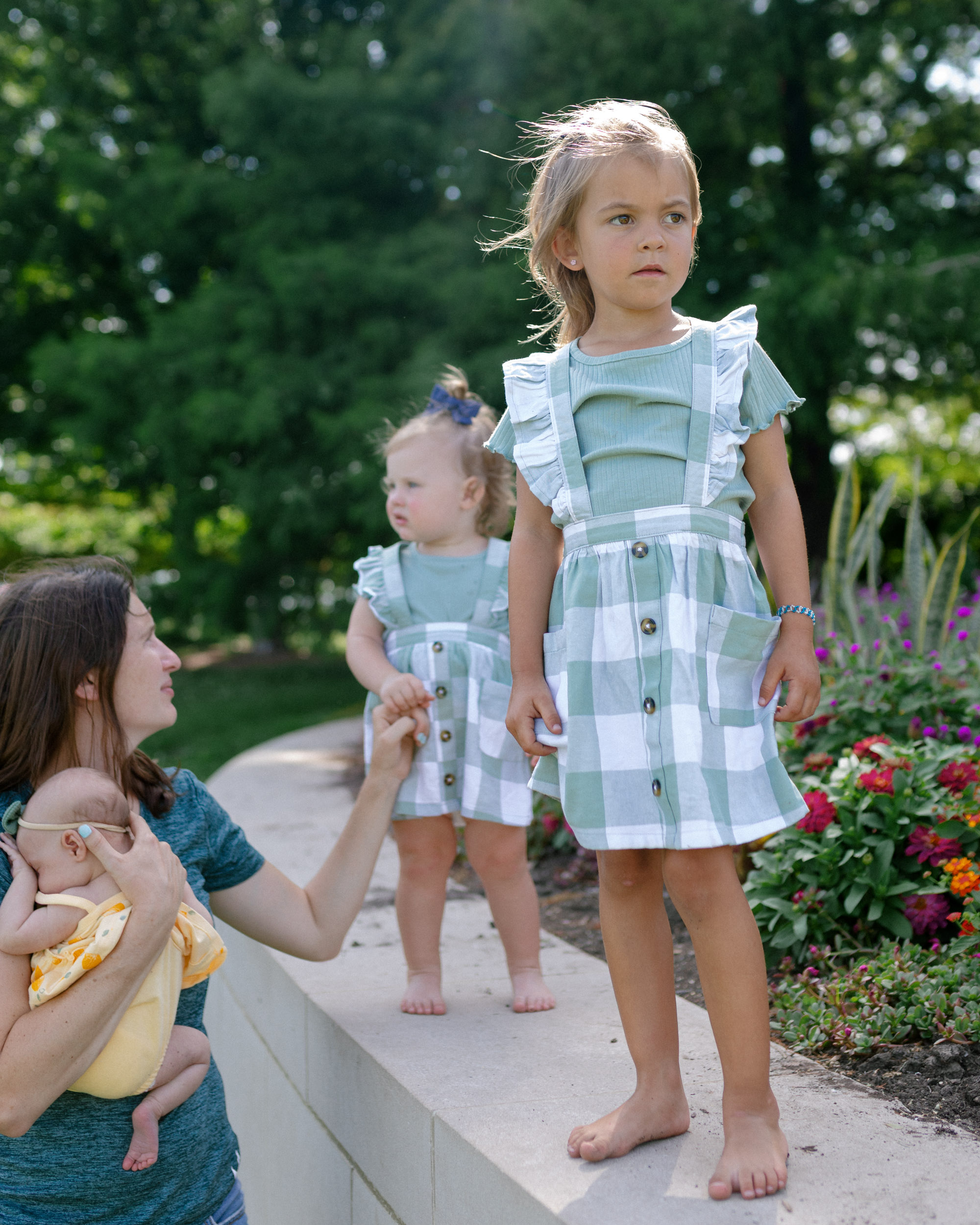 Mother with three daughters during a summer family portrait session in St. Louis