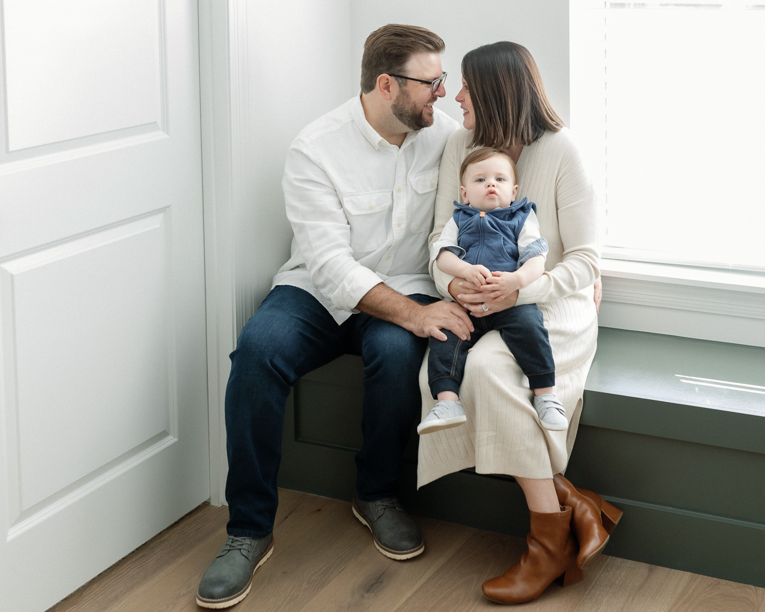 Two young sisters running through bubbles during a family photography session in St Louis