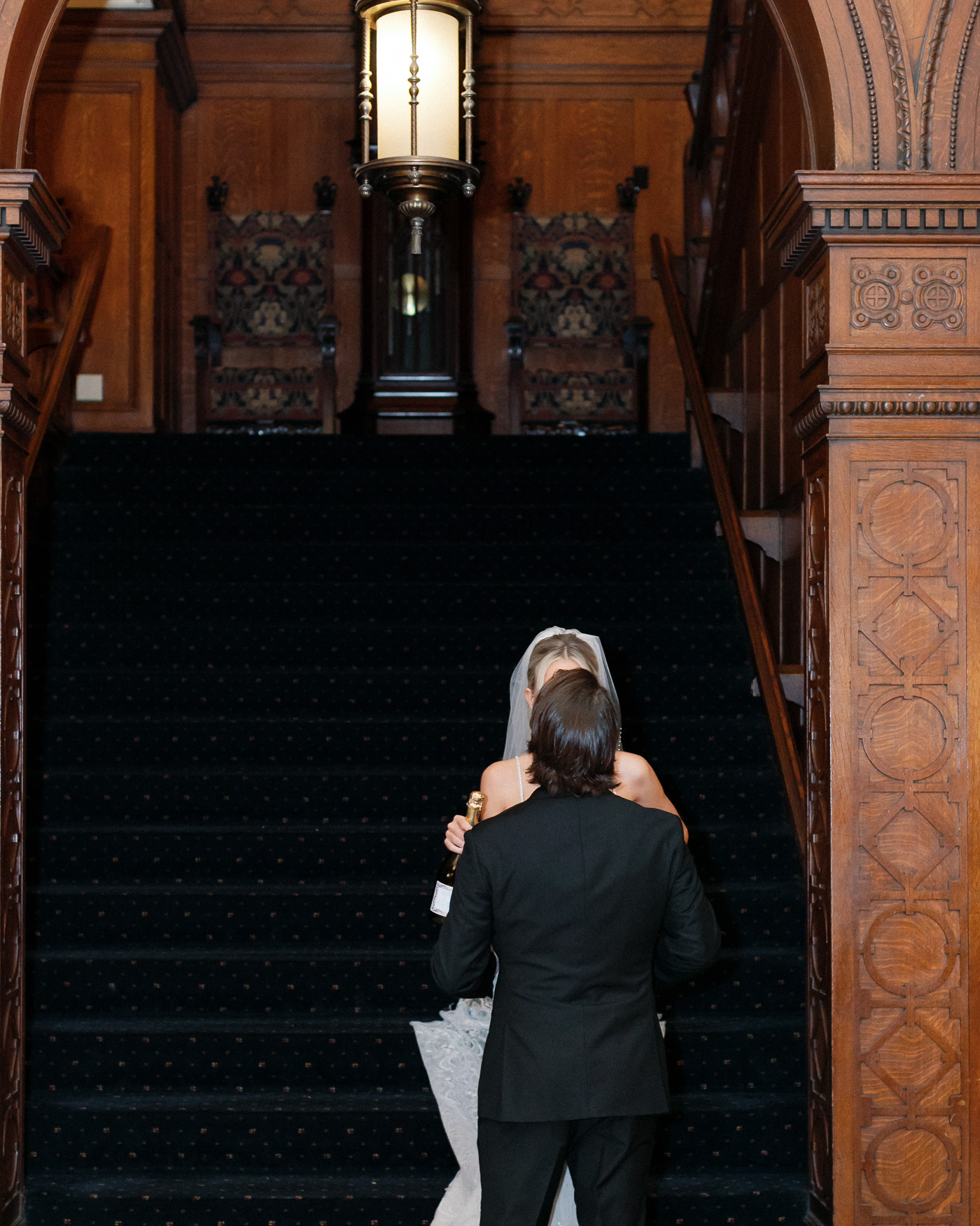 Champagne bottle detail during first look wedding photography in St. Louis